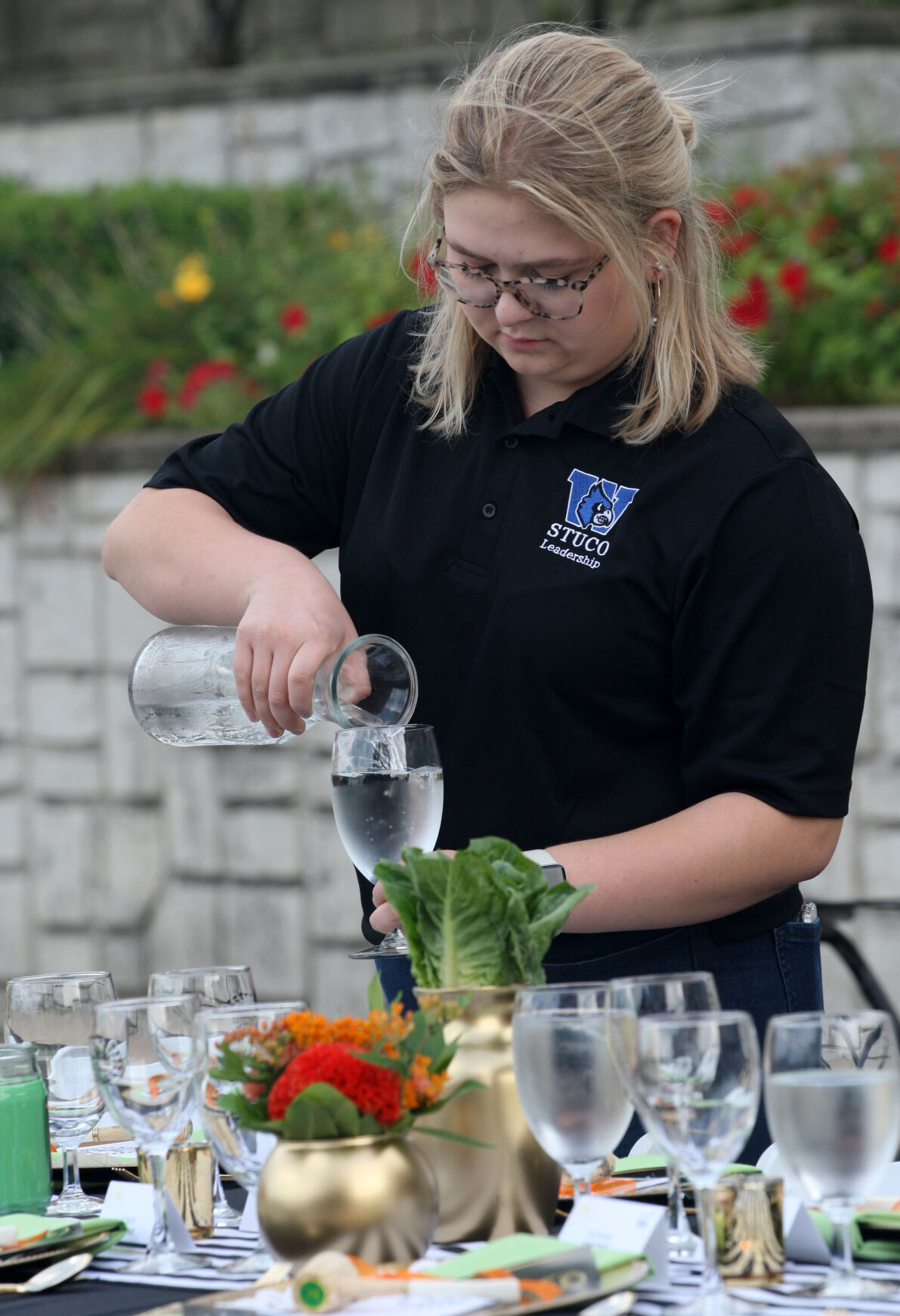 Ella Scott pours water